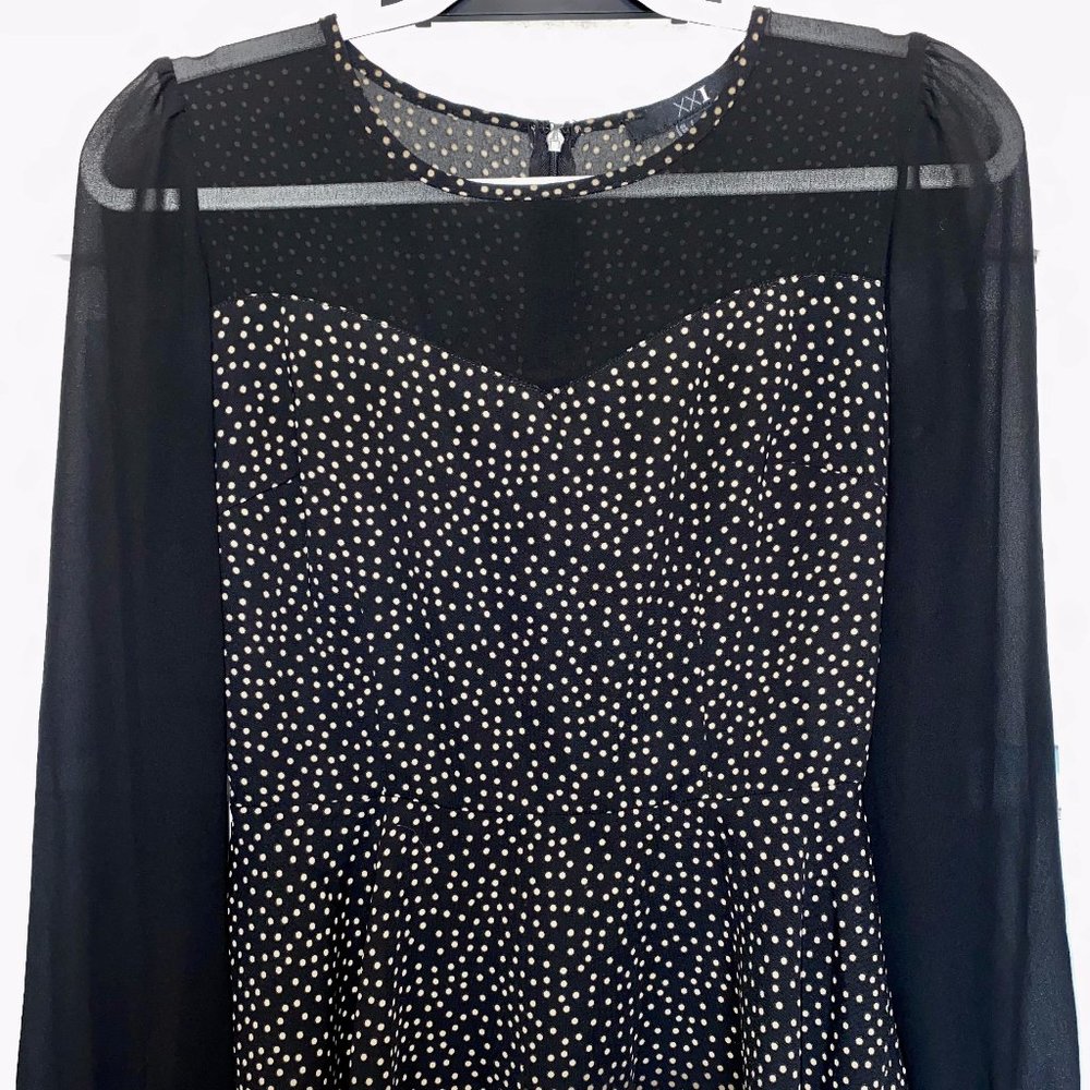 Sheer, black, long sleeve peplum blouse!